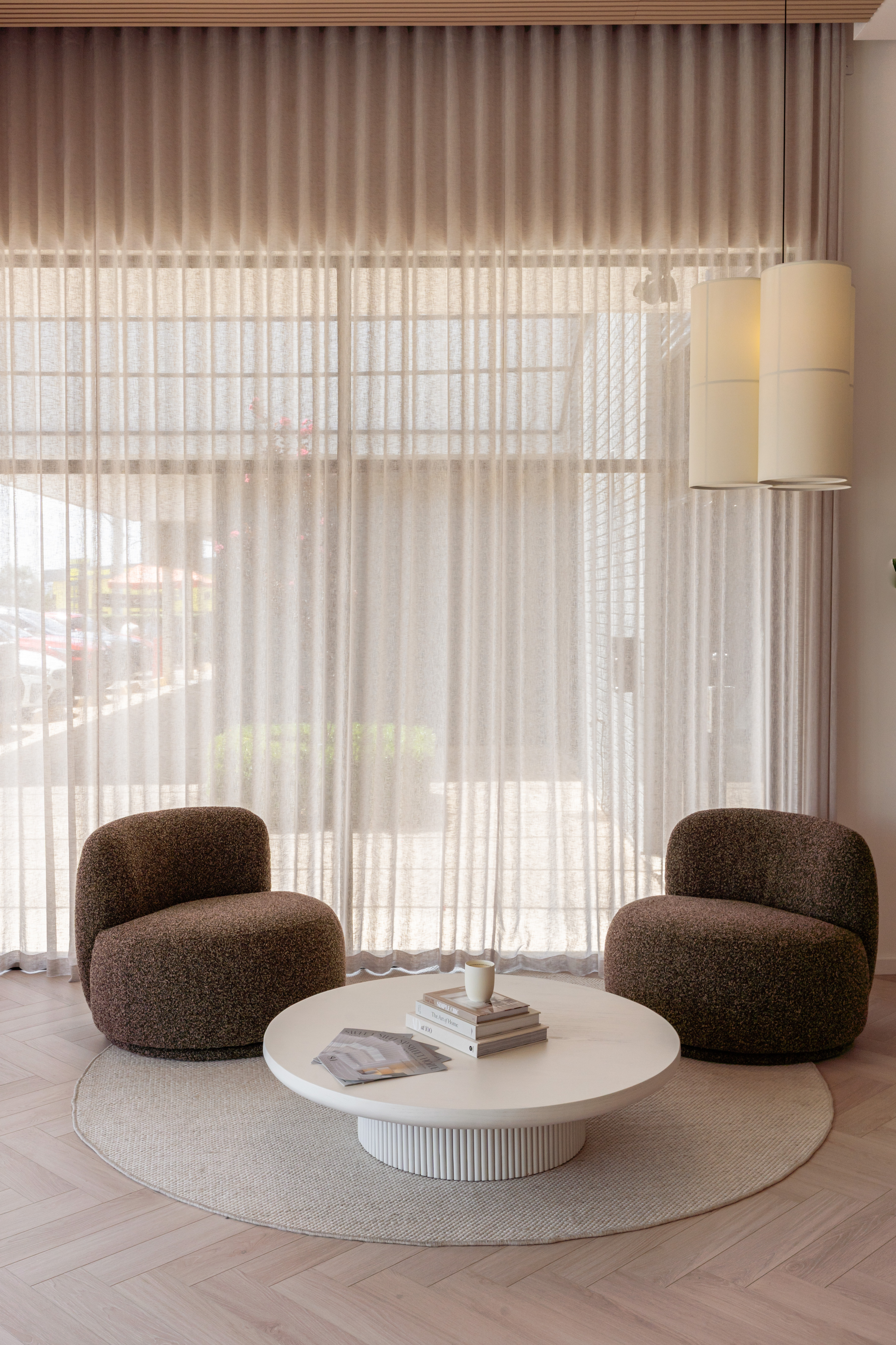 Premium sheer curtain detail against brick wall